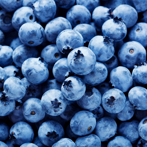 Close-up of a cluster of fresh blueberries with a deep blue hue.