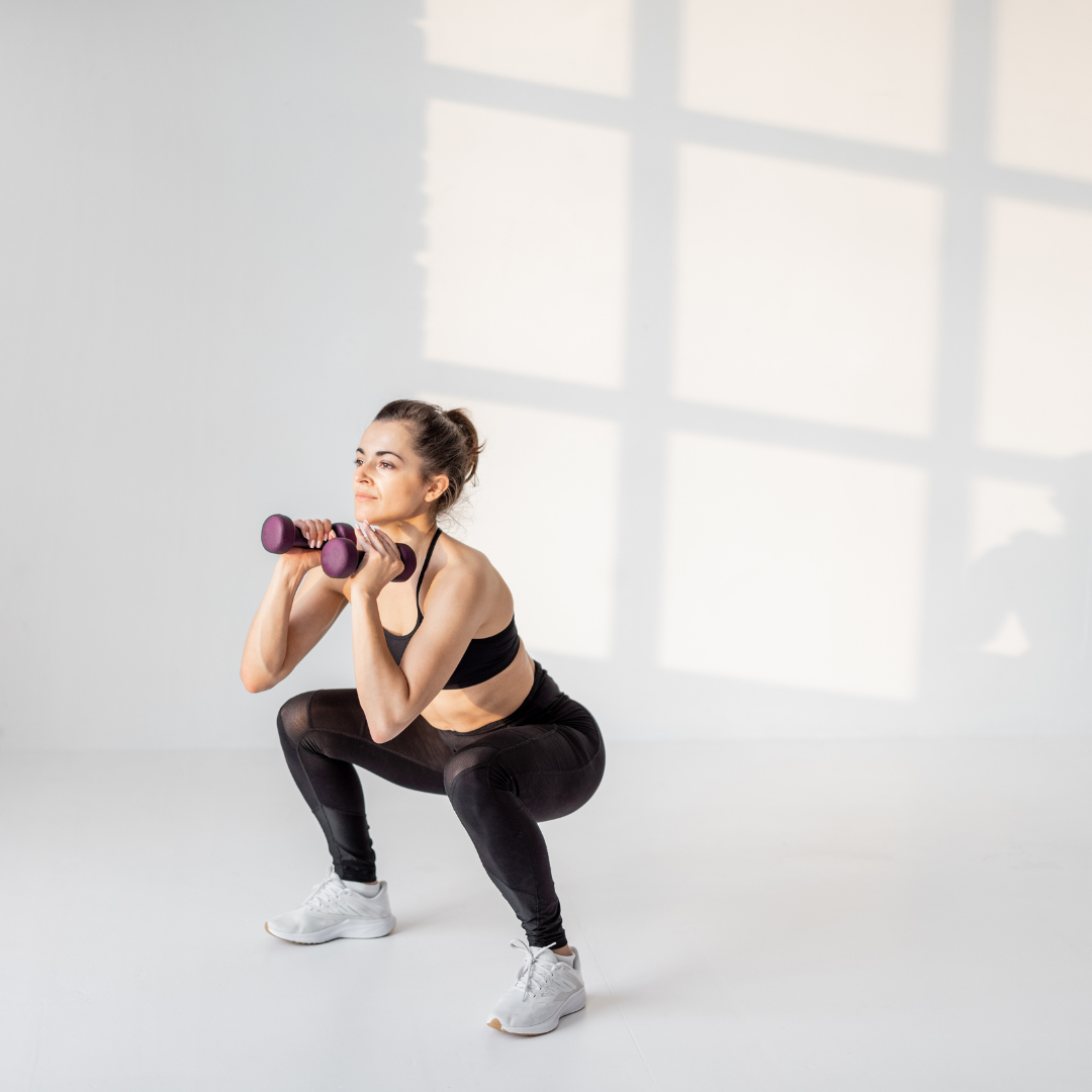Fit woman using dumbbells to workout